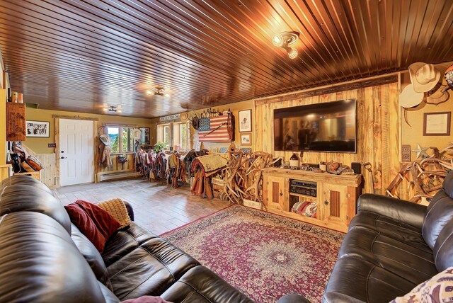 5 Alpine Valley Ln, Clancy, MT 59634 - living room with wooden ceiling, wooden walls, wood finished floors, and a baseboard radiator