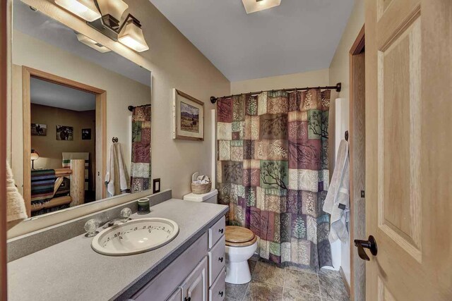 5 Alpine Valley Ln, Clancy, MT 59634 - bathroom with vanity, a shower with shower curtain, and stone finish flooring