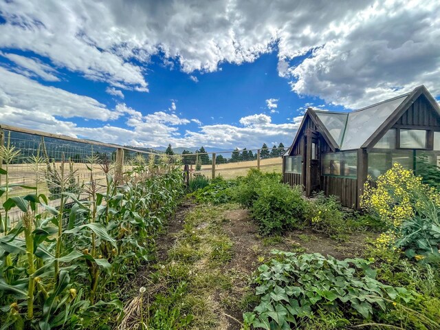 5 Alpine Valley Ln, Clancy, MT 59634 - view of yard with a greenhouse and an outbuilding