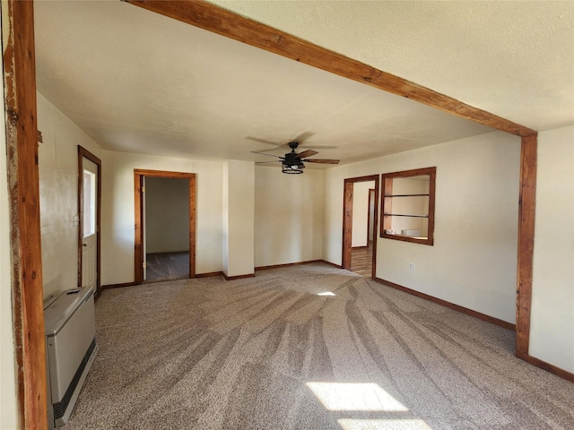 105 Stapp Ln, Darby, MT 59829 - carpeted spare room featuring baseboards, a ceiling fan, and heating unit