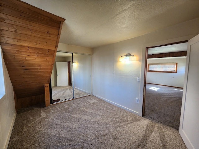 105 Stapp Ln, Darby, MT 59829 - unfurnished bedroom with baseboards, a textured ceiling, and carpet floors