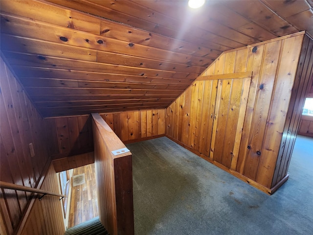 105 Stapp Ln, Darby, MT 59829 - additional living space with baseboards, wooden walls, dark carpet, lofted ceiling, and wooden ceiling