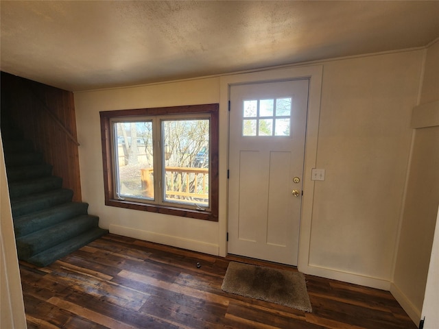 105 Stapp Ln, Darby, MT 59829 - entrance foyer with baseboards, dark wood finished floors, and stairway