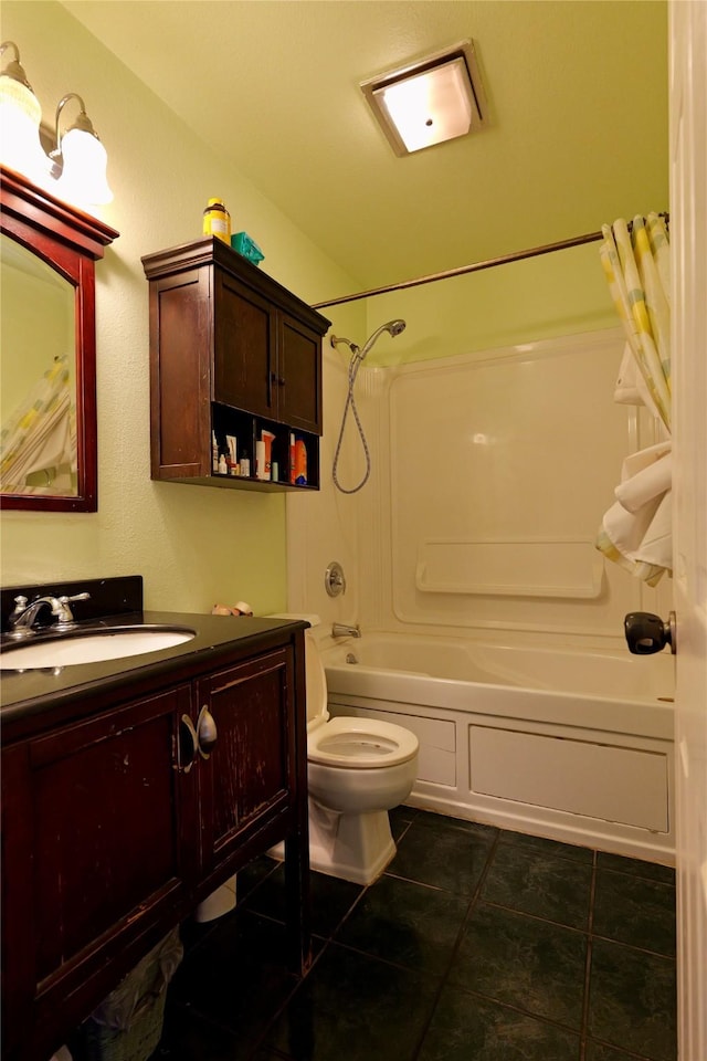 261 Locust Ln, Seeley Lake, MT 59868 - bathroom with tile patterned floors, vanity, bathtub / shower combination, and toilet