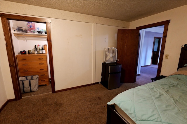 261 Locust Ln, Seeley Lake, MT 59868 - bedroom featuring refrigerator, carpet flooring, a textured ceiling, and baseboards