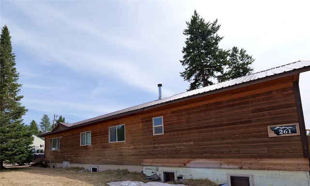 261 Locust Ln, Seeley Lake, MT 59868 - view of property exterior with a metal roof