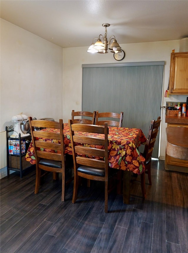 261 Locust Ln, Seeley Lake, MT 59868 - dining area featuring a chandelier and dark wood-style floors