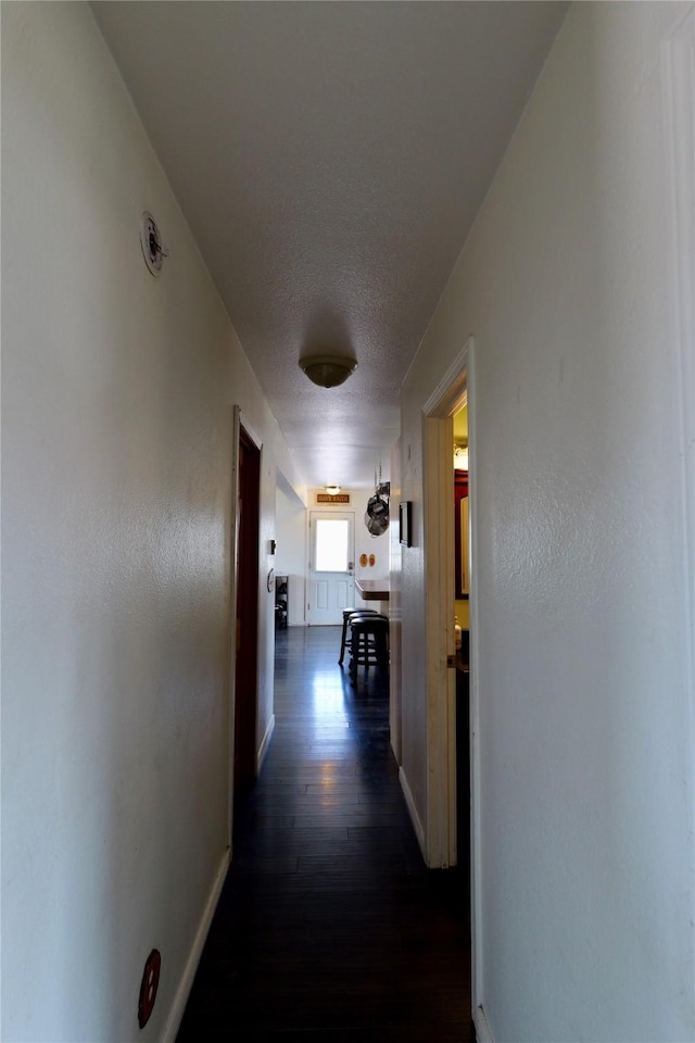 261 Locust Ln, Seeley Lake, MT 59868 - hall with dark wood finished floors and baseboards