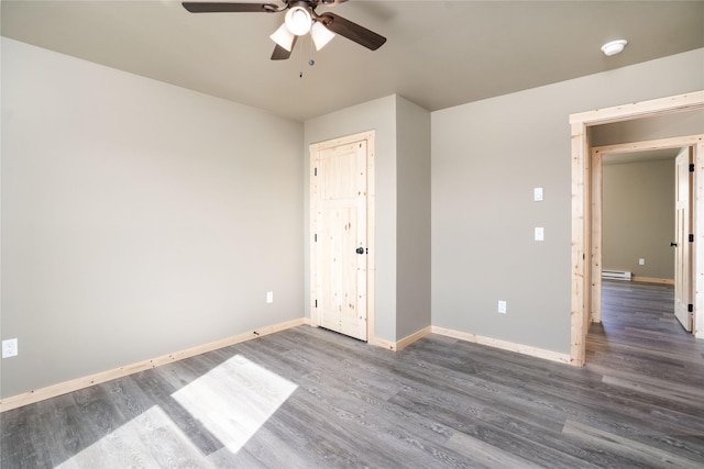 471 Lower Deep Creek Rd, Townsend, MT 59644 - unfurnished bedroom featuring a baseboard radiator, ceiling fan, wood finished floors, and baseboards