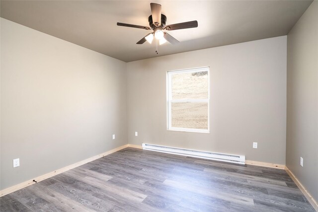 471 Lower Deep Creek Rd, Townsend, MT 59644 - empty room featuring ceiling fan, a baseboard heating unit, wood finished floors, and baseboards