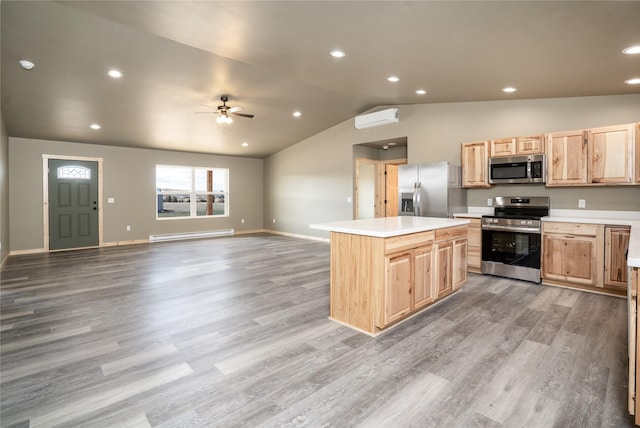 471 Lower Deep Creek Rd, Townsend, MT 59644 - kitchen with light brown cabinets, a center island, a ceiling fan, stainless steel appliances, and a baseboard radiator