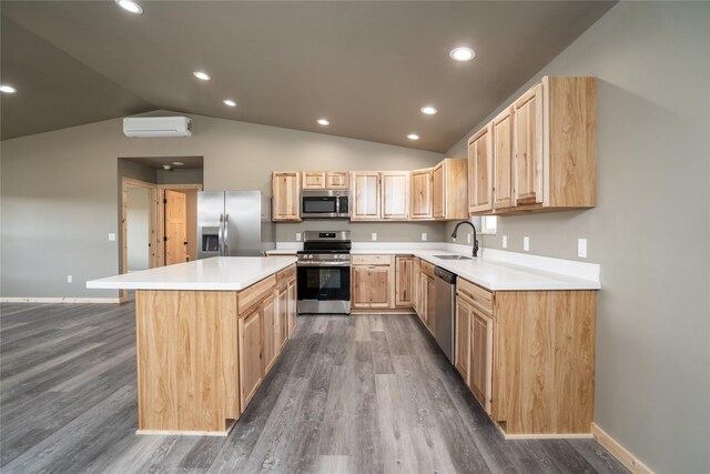 471 Lower Deep Creek Rd, Townsend, MT 59644 - kitchen featuring light brown cabinets, a wall mounted air conditioner, a sink, appliances with stainless steel finishes, and vaulted ceiling