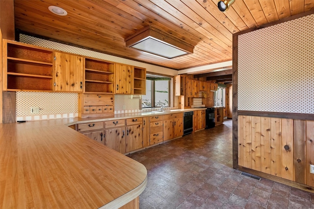 2041 Sleeping Child Rd, Hamilton, MT 59840 - kitchen with open shelves, wood ceiling, black appliances, wallpapered walls, and light countertops