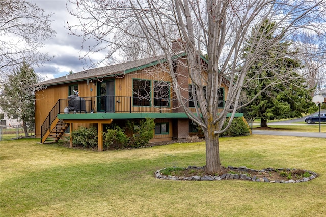 exterior space featuring stairway and a lawn