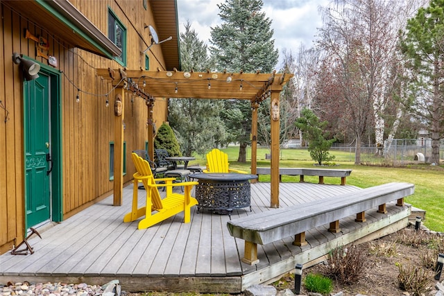deck with a pergola, a yard, and fence