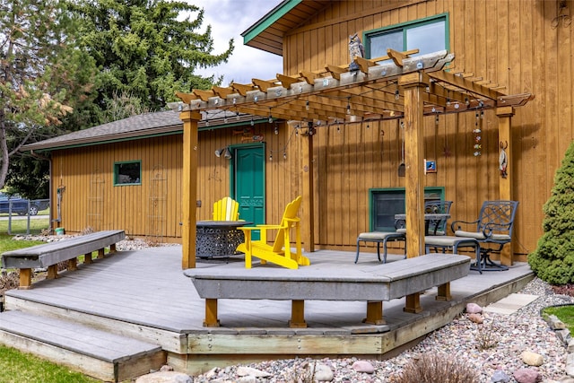 wooden deck featuring a pergola