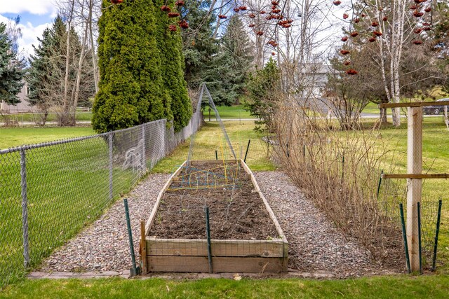 exterior space with a garden and fence