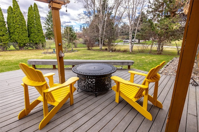 wooden terrace with fence and a lawn