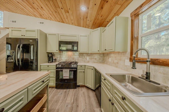 1365 Bierney Creek Rd, Lakeside, MT 59922 - kitchen with black appliances, wooden ceiling, decorative backsplash, lofted ceiling, and light wood finished floors