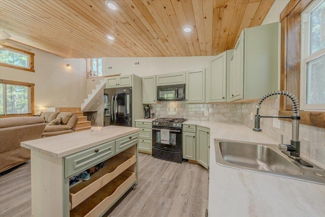 1365 Bierney Creek Rd, Lakeside, MT 59922 - kitchen featuring black appliances, green cabinets, wood ceiling, light countertops, and decorative backsplash
