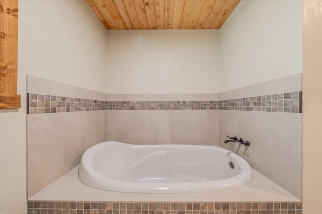 1365 Bierney Creek Rd, Lakeside, MT 59922 - bathroom featuring a garden tub, wood ceiling, and tile walls
