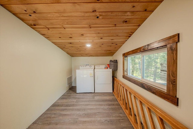 1365 Bierney Creek Rd, Lakeside, MT 59922 - laundry room with washer and clothes dryer, wood ceiling, light wood finished floors, and recessed lighting