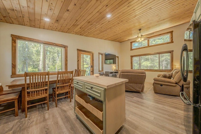 1365 Bierney Creek Rd, Lakeside, MT 59922 - kitchen featuring freestanding refrigerator, wood ceiling, light wood-style floors, a ceiling fan, and recessed lighting