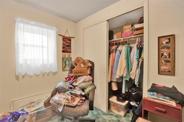 bedroom with a closet and a textured ceiling