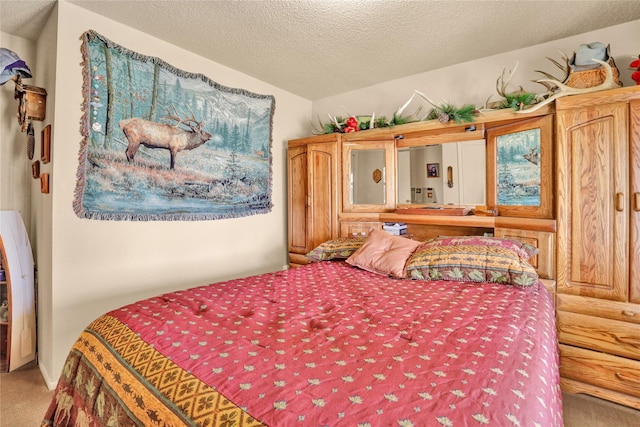 carpeted bedroom with a textured ceiling