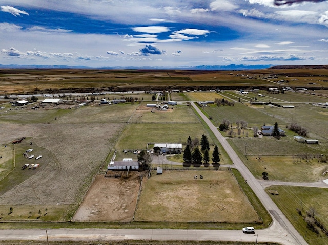 drone / aerial view featuring a rural view and a mountain view