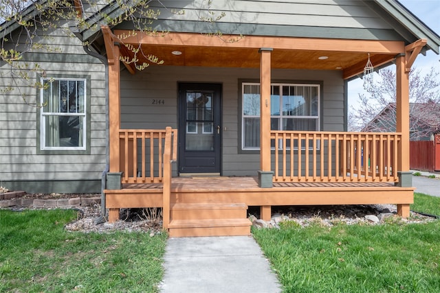 doorway to property featuring covered porch