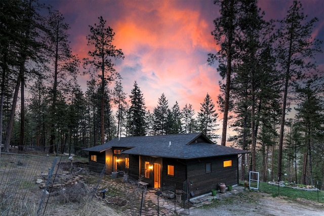 exterior space with a shingled roof