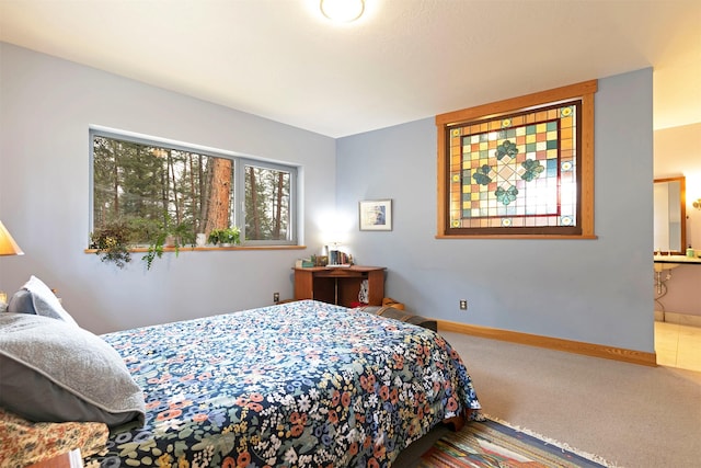 carpeted bedroom with baseboards