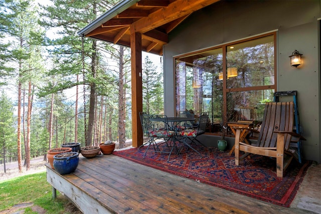 deck with outdoor dining space