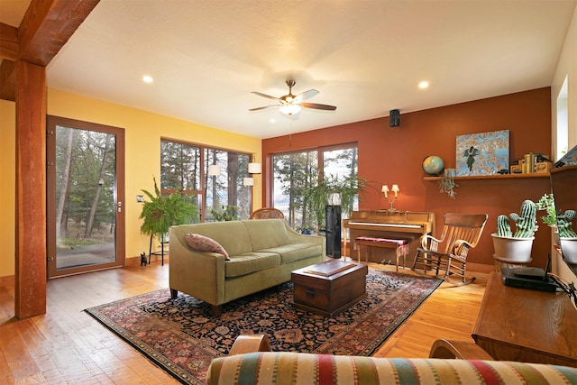 living room with baseboards, a ceiling fan, hardwood / wood-style floors, and recessed lighting