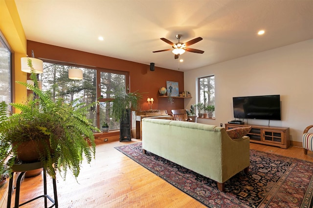 living area featuring recessed lighting, wood finished floors, and ceiling fan