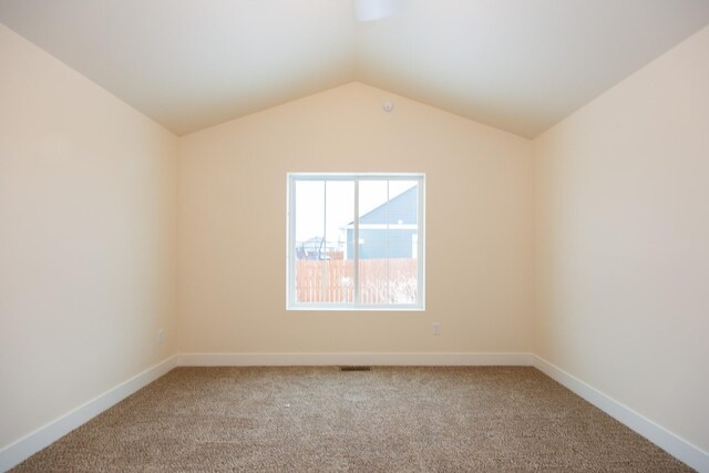327 Meadow View Loop, East Helena, MT 59635 - spare room with carpet floors, baseboards, and lofted ceiling