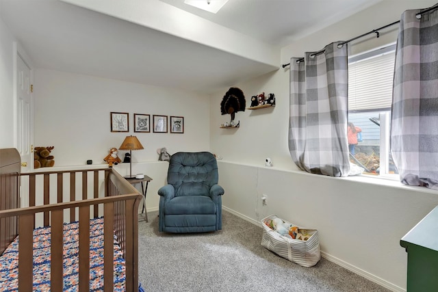 carpeted bedroom featuring baseboards