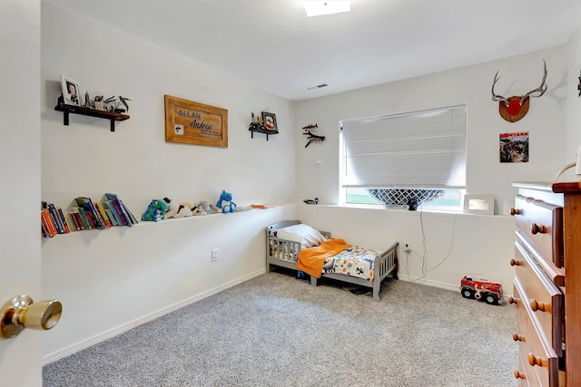 bedroom with visible vents, baseboards, and carpet flooring