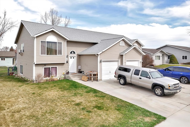 bi-level home featuring a garage, roof with shingles, driveway, and a front lawn