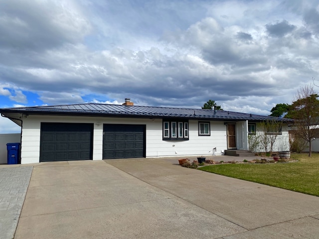1405 2ND W Hill Dr, Great Falls, MT 59404 - view of front of house featuring driveway, a chimney, an attached garage, a standing seam roof, and a metal roof