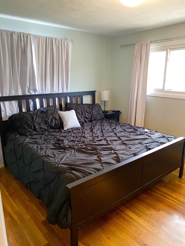 1405 2ND W Hill Dr, Great Falls, MT 59404 - bedroom with wood finished floors and a textured ceiling