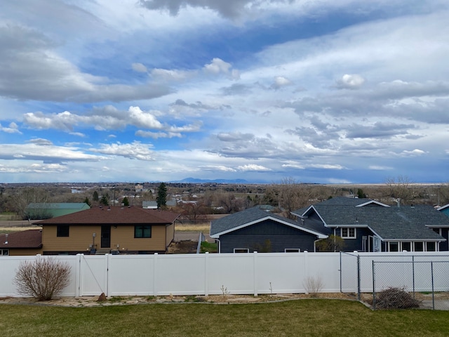 1405 2ND W Hill Dr, Great Falls, MT 59404 - fenced backyard featuring a mountain view and a residential view