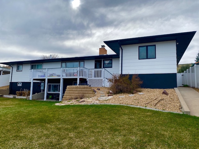 1405 2ND W Hill Dr, Great Falls, MT 59404 - rear view of house with a wooden deck, a chimney, and stairs