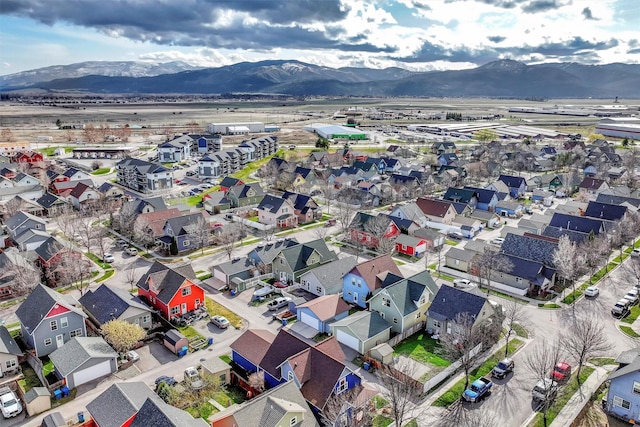 birds eye view of property with a mountain view and a residential view