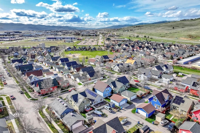 birds eye view of property with a mountain view and a residential view