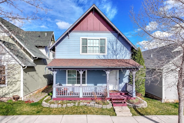 view of front of property featuring roof with shingles and covered porch