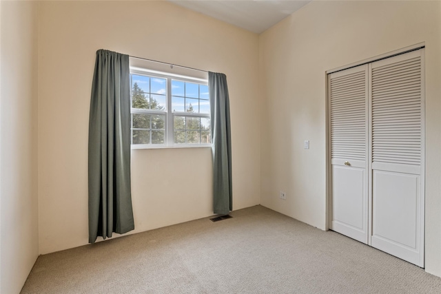 1636 Lake Blaine Rd, Kalispell, MT 59901 - unfurnished bedroom featuring light colored carpet and a closet