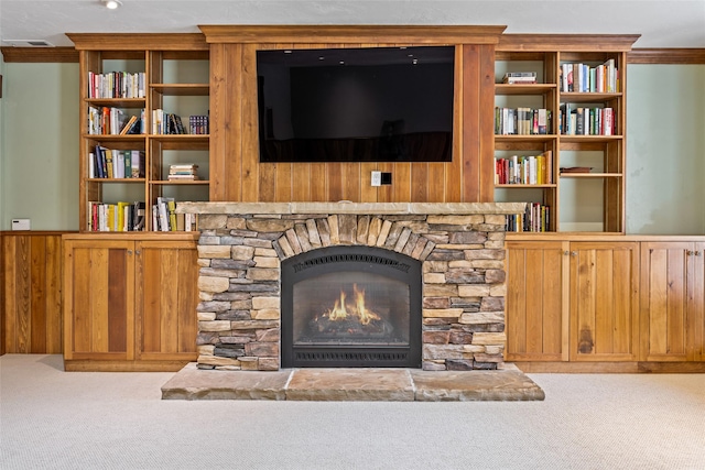 1636 Lake Blaine Rd, Kalispell, MT 59901 - living room with carpet, a fireplace, ornamental molding, and wood walls