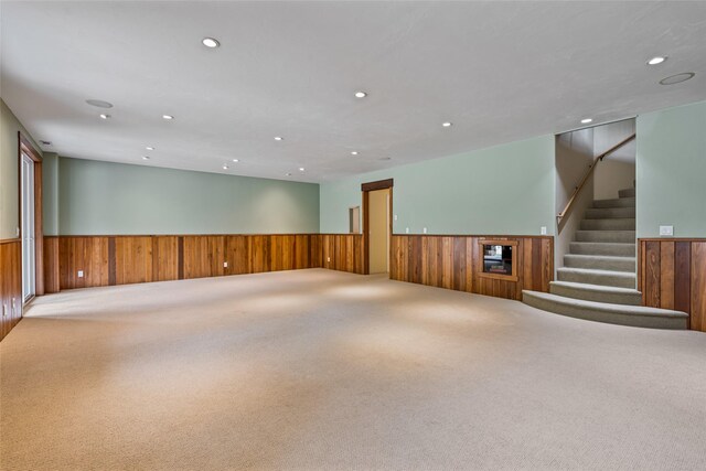 1636 Lake Blaine Rd, Kalispell, MT 59901 - basement with wainscoting, wood walls, recessed lighting, carpet floors, and stairs